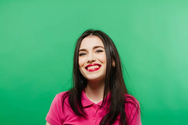 Attractive smiling woman portrait on green background — Stock Photo, Image