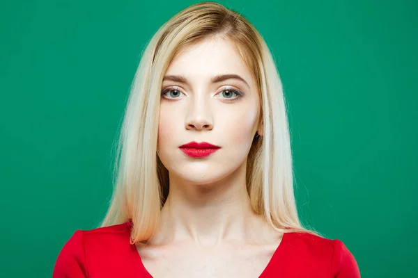 Closeup Portrait of Young Pretty Woman with Sensual Lips and Professional Makeup Wearing Red Top on Green Background in Studio. — Stock Photo, Image