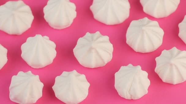 Macro Video of Soft, Fluffy, White Marshmallows on Pink Background. — Stock Video