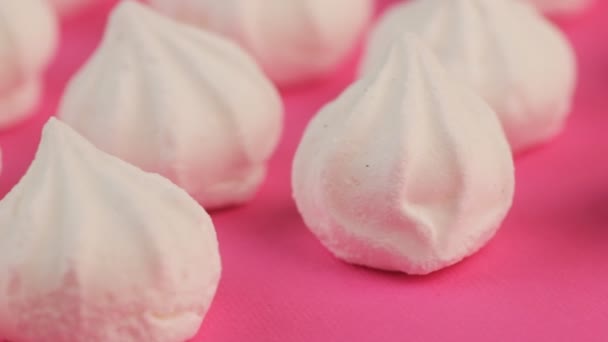 Macro Video of Soft, Fluffy, White Marshmallows on Pink Background. — Stock Video