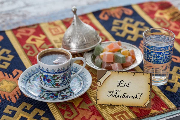 Eid mubarak text  on greeting card with turkish coffee, delights — Stock Photo, Image