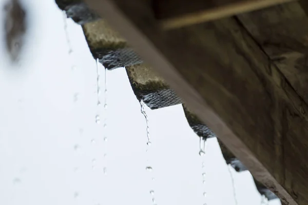 Rain falls from the roof, rainy season in Thailand, Asia, rainy