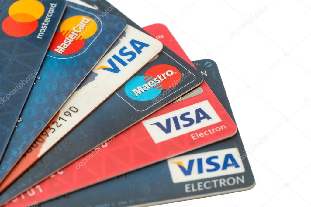 Sarajevo, Bosnia and Herzegovina - Jun 25, 2017: closeup pile of credit cards, Visa and MasterCard, credit, debit and electronic. Isolated on white background with clipping path. Design element.