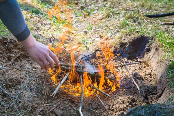 Safely lighting a fire in the forest countryside — 스톡 사진