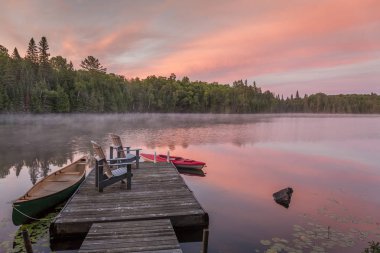 Cottage Dock on a Canadian Lake at Dawn at Dawn  clipart