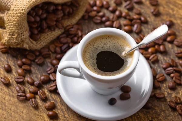 Black coffee on the old background — Stock Photo, Image