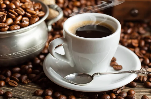 Black coffee on the old background — Stock Photo, Image