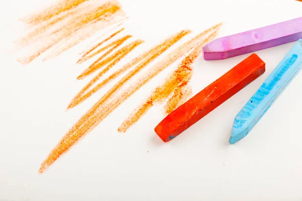 Crayons on a paper sheet — Stock Photo, Image