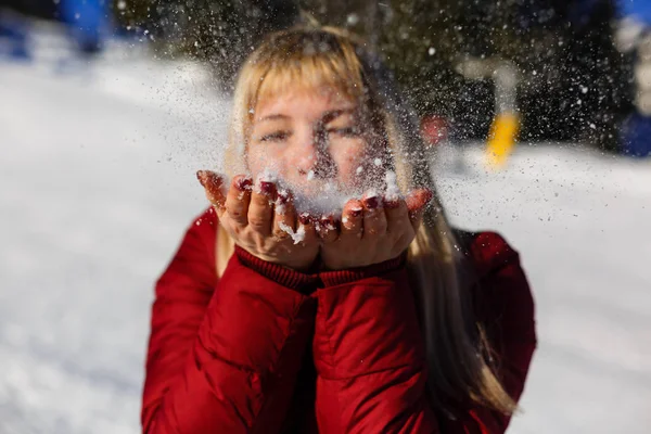 Woman Blowing Snow Her Palms Winter Day — Stockfoto