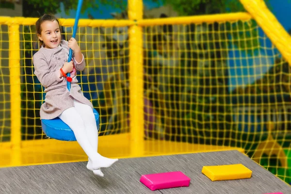 Little pretty girl is having fun outdoor. Playing in children zo — Stock Photo, Image
