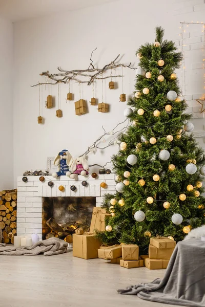 interior decorated with christmas tree and gifts