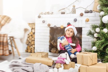 Cute girl at home at Christmas time