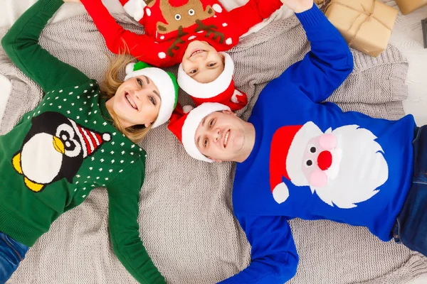 Happy family in Christmas clothes