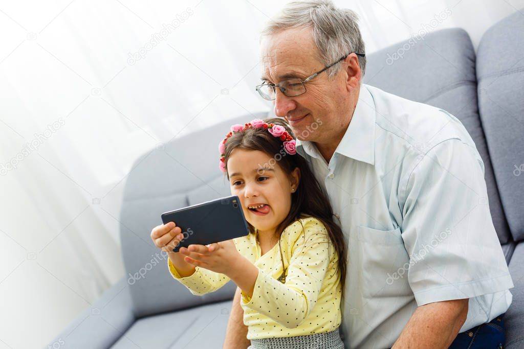 Grandfather and granddaughter spending time together 