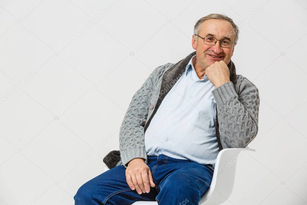 Smiling happy elderly man. Isolated over white background 