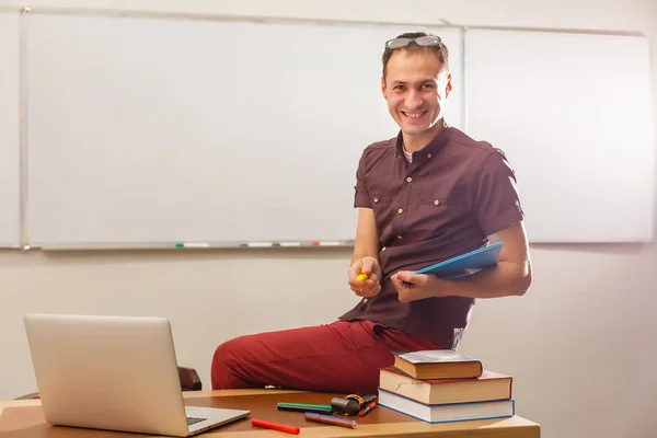 Young Male Teacher Holding Book Maths Classroom — 스톡 사진