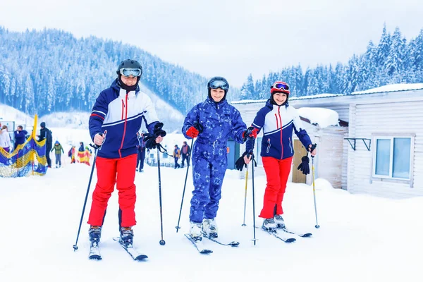 Group of friends with ski walking at a ski resort