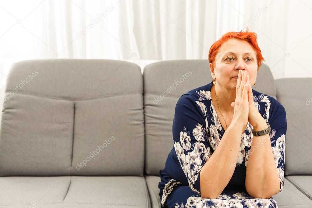 Old Woman Praying at home