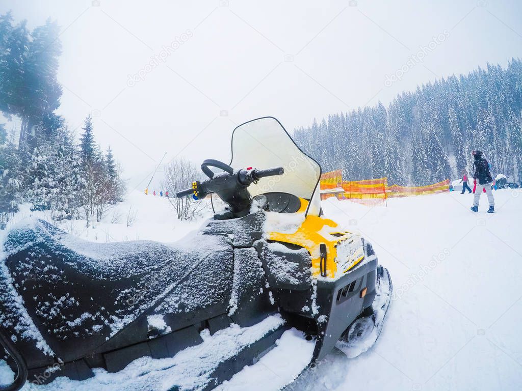 Winter Motorcycle. Snowmobile. Winter ATVs. Winter ATVs in winter against the backdrop of the mountain.