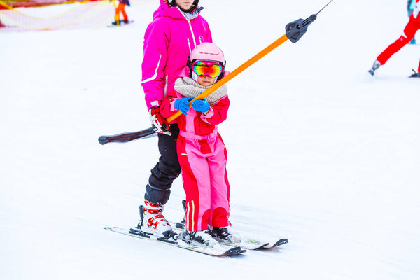 Skiing, little skier in ski school