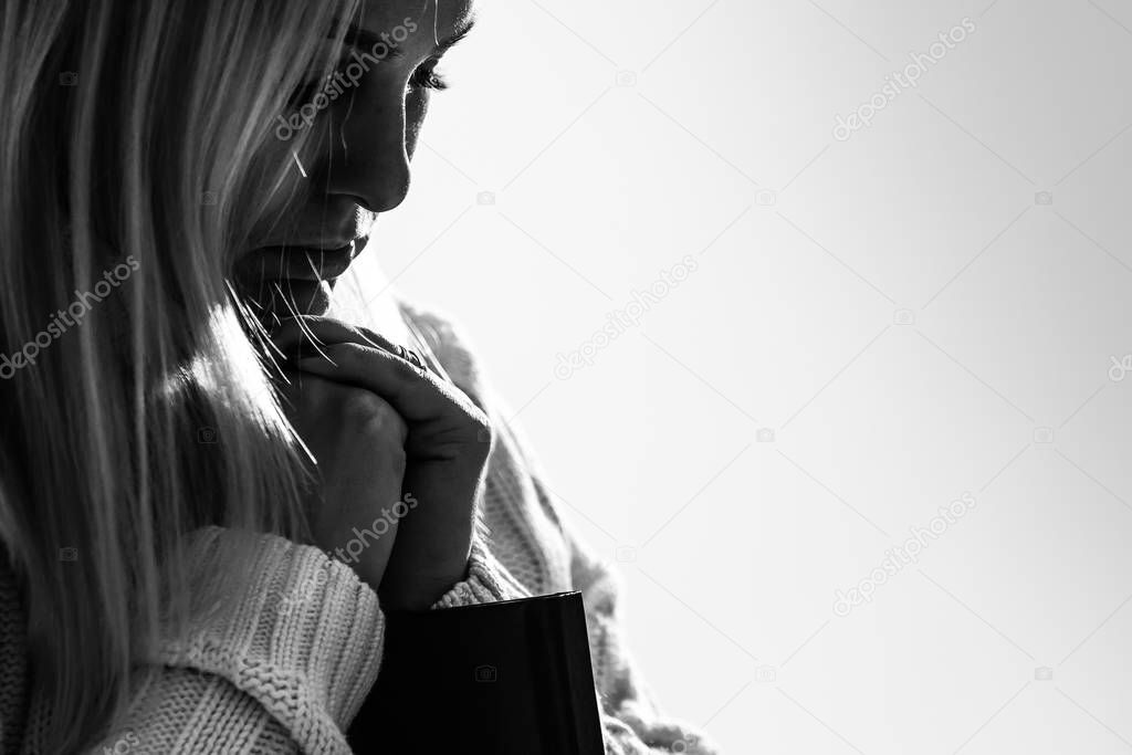 Woman hands praying to god with the bible. Woman Pray for god blessing to wishing have a better life. begging for forgiveness and believe in goodness. Christian life crisis prayer to god.
