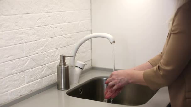 Close-up of woman using hand sanitizer gel to prevent spreading virus — Stock Video