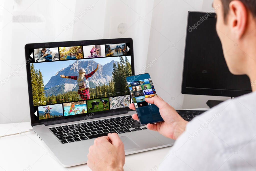 Man watching TV channels by laptop online