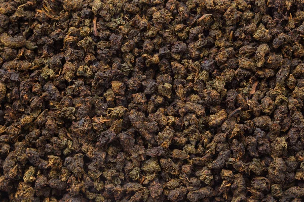 Teekräuter Textur. Oolong-Tee Hintergrund. Bio getrocknete grüne Teeblätter. — Stockfoto
