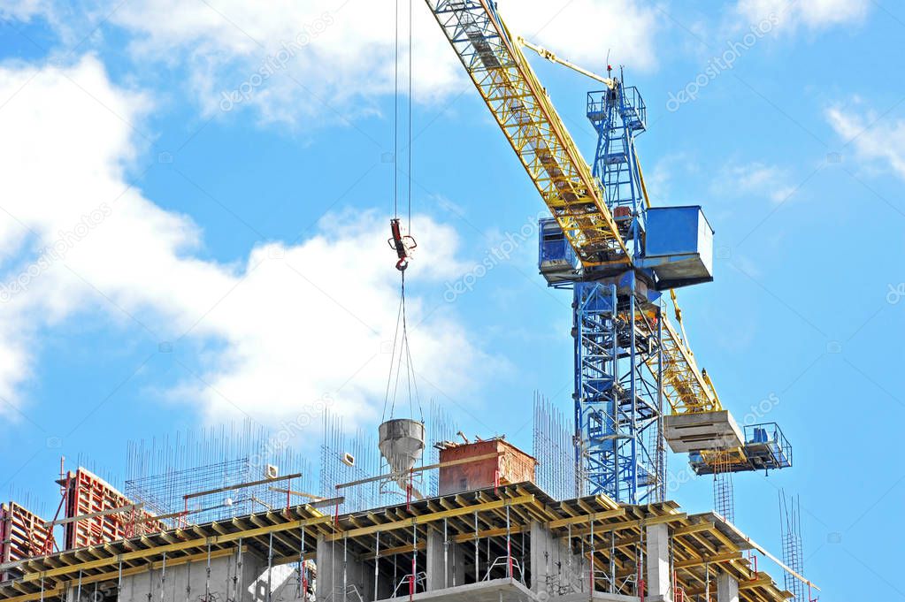 Crane lifting cement mixing container — Stock Photo © unkas #141081504