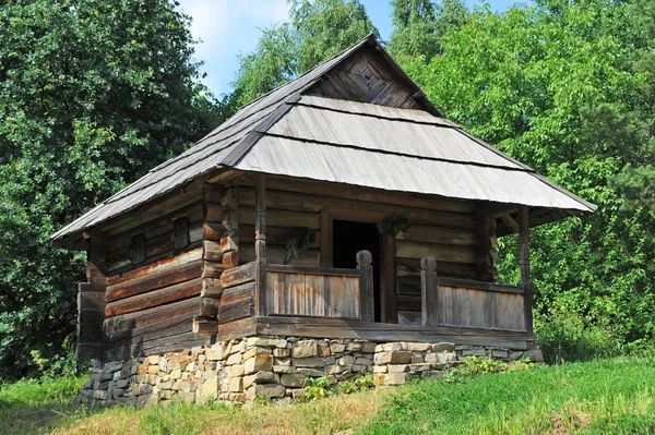 Ancient carpatian hut in forest