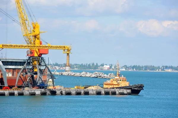 Tugboat and port cargo crane — Stock Photo, Image