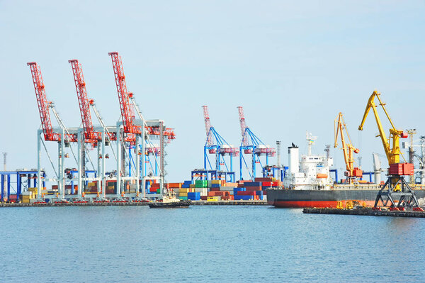 Tugboat assisting bulk cargo ship