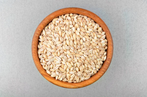 Barley grits in bowl — Stock Photo, Image