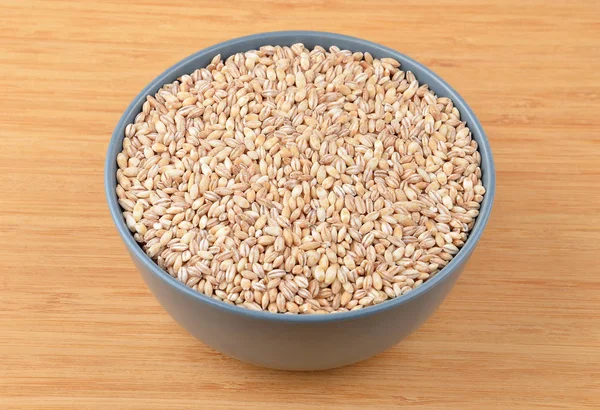 Barley grits in bowl — Stock Photo, Image