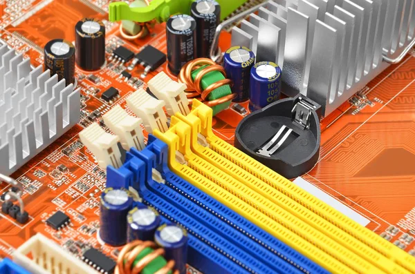 Orange computer motherboard — Stock Photo, Image