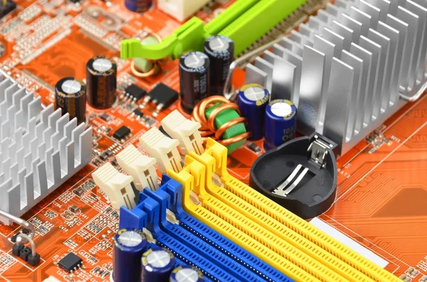 Orange computer motherboard — Stock Photo, Image