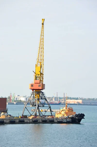 Tugboat and port cargo crane — Stock Photo, Image