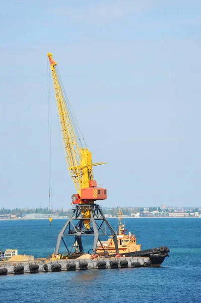 Tugboat and port cargo crane — Stock Photo, Image