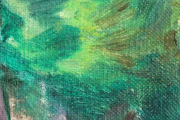 Green color oil paint on linen. Abstract art background. Coarse woolen fabric texture. Brushstrokes of paint.