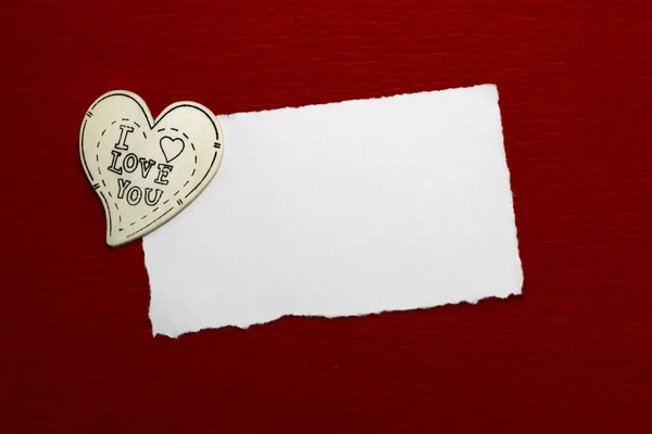 Wooden heart and white sheet of paper — Stock Photo, Image