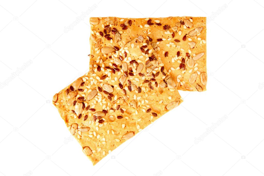 Crispy bread with seeds of sunflower, flax and sesame, isolated