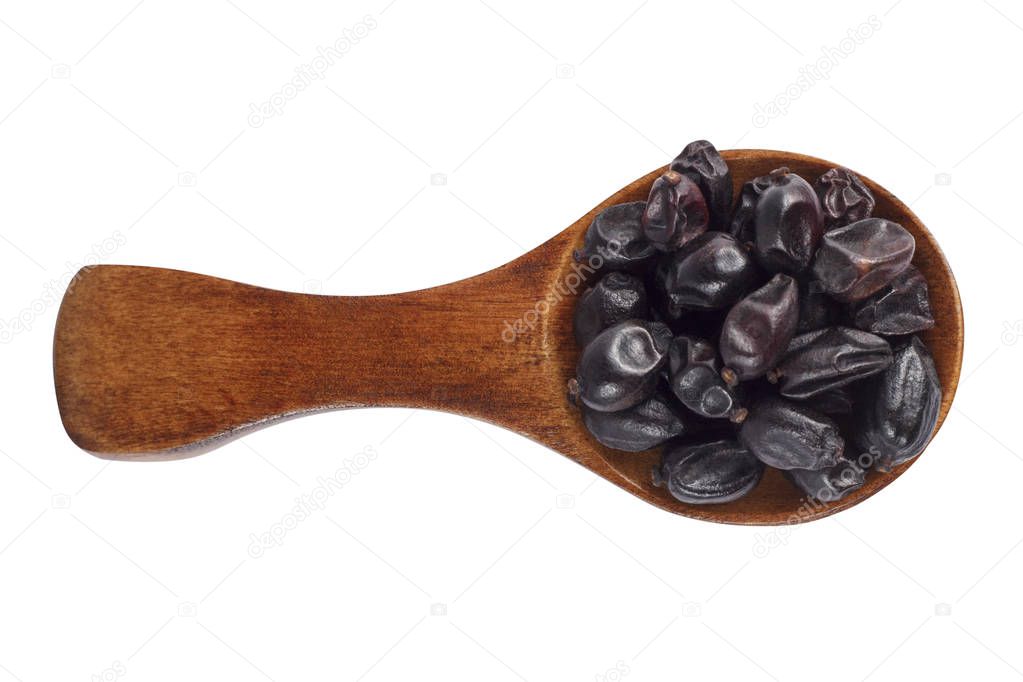 Dried barberry in spoon on white background
