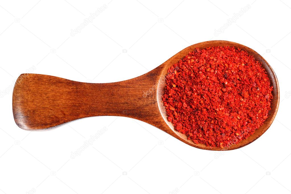 Red ground pepper in a wooden spoon