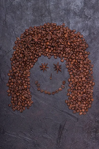 face of coffee beans on a concrete background