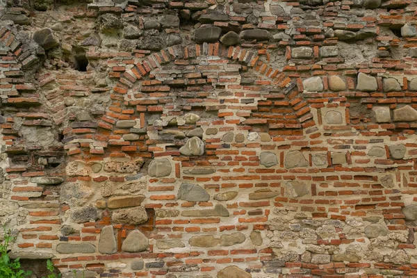 Antik bozulma tuğla ve taş duvar arka planı