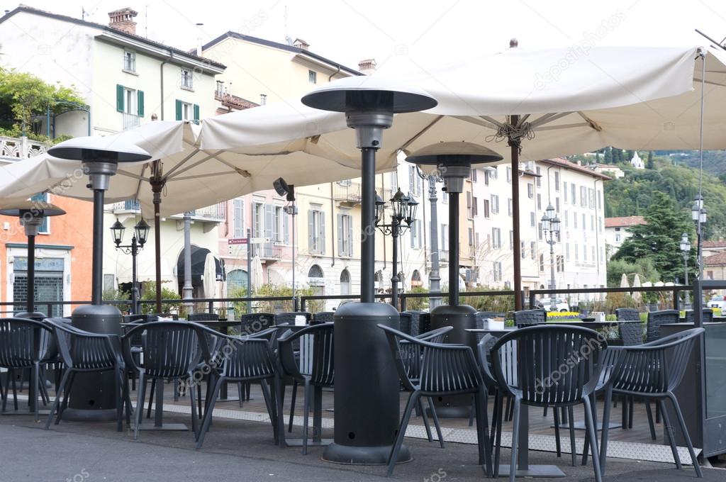 heaters and tables of street cafe
