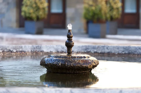 Old fountain in the square in Bergamo — Stock Photo, Image
