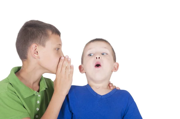 Older boy tells the secret to the younger one — Stock Photo, Image