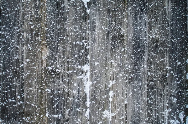Copos de nieve en las tablas de madera — Foto de Stock