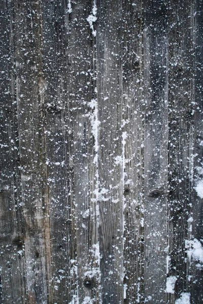 Fiocchi di neve sulle tavole di legno — Foto Stock